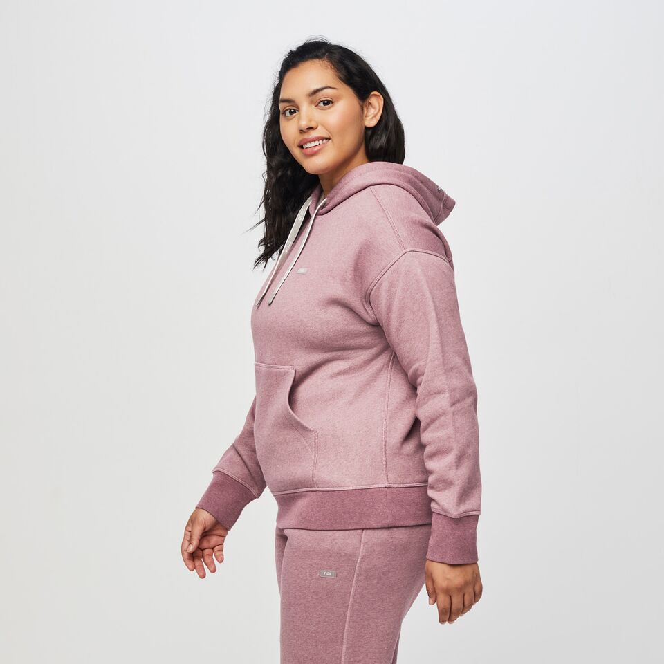 https://creative.wearfigs.com/asset/b09e2b23-f113-4d81-b8f0-f64862c61b11/SQUARE/XL_W_Hoodie_Heather_Dark_Mauve_Q3_2022_-3