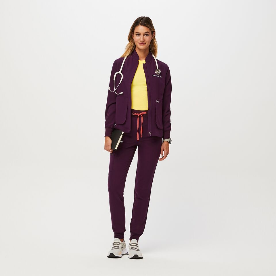 https://creative.wearfigs.com/asset/c9264fda-5fca-4abd-ba85-5d3583aee5ea/SQUARE/Q2_2023_06_DEEP-PURPLE_SEBINA-JACKET_W_MADI_35948