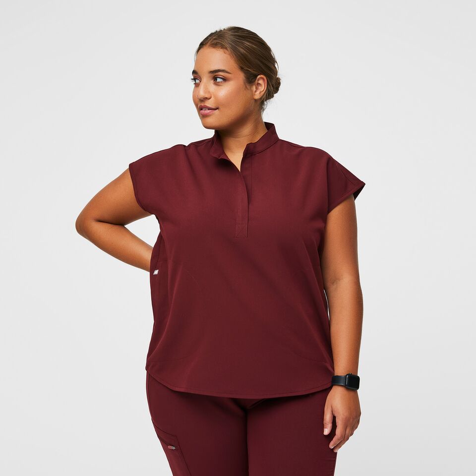 https://creative.wearfigs.com/m/4aaa8a8d31b0eaa8/SQUARE-XL_W_Rafaela_Top_Burgundy_Updated_Backrgound_Core_2022_-2