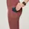 https://images.ctfassets.net/5j6wpslh72e4/23E5CmSiGexrIS0dSDiZaM/1deec24051ab13d7c649423165f97d6e/W_300_Perf_Leggings_Deep_Mauve_Q1_2022__5.jpg