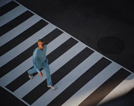 Video featuring healthcare professionals wearing the FIGS x Marvel Spider-Man Collection throughout city streets.