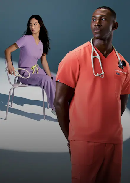 Healthcare professionals wearing FIGS scrubs in Purple Haze and Fireside showcasing the latest color launch and returning best-selling shade.