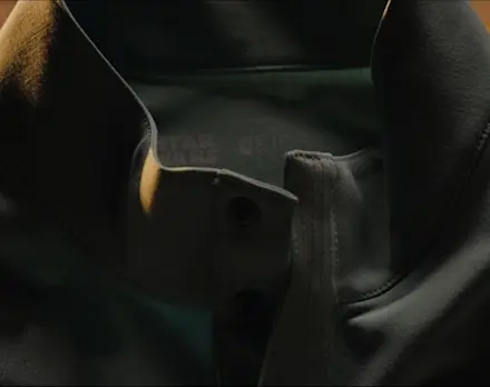 Video showcasing the FIGS x Star Wars™ Collection, featuring limited-edition scrubs and accessories displayed in a desert-inspired setting with cinematic close-up product details.