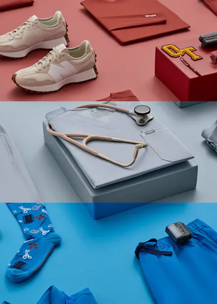 Flat lay of FIGS Back-to-School collection featuring medical apparel, accessories, jewelry, and essentials in Sienna, Harbor Grey, and Blue Horizon.