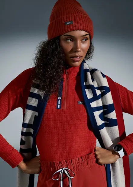 Collage featuring Team USA-inspired apparel and accessories with imagery highlighting the FIGS x Team USA Collection.
