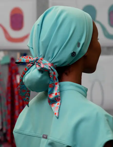 MADE WITH LOVE. Farida L., RN couldn’t find a scrub cap that worked for her hair—so she designed one. We teamed up to make it real.