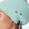 https://cdn.shopify.com/s/files/1/0139/8942/files/2025_Q2_05_SEAGLASS_FARIDASCRUBCAP_LAURYN_559.jpg?v=1745437289