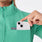 https://cdn.shopify.com/s/files/1/0139/8942/files/2025_Q2_05_SURGICAL-GREEN_LOMITA-FULL-ZIP_MADI_1344.jpg?v=1751324018
