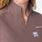 https://cdn.shopify.com/s/files/1/0139/8942/files/2026_Q1_03_SMOKEY-TAUPE_STAR-WARS-SCRUB-TOP_CLARA_355.jpg?v=1775763162