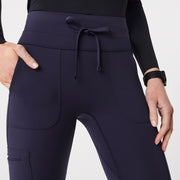 https://cdn.shopify.com/s/files/1/0139/8942/files/Q1_2024_1_NAVY_SCRUB_LEGGING_W_CLARA_1123.jpg?v=1707873081