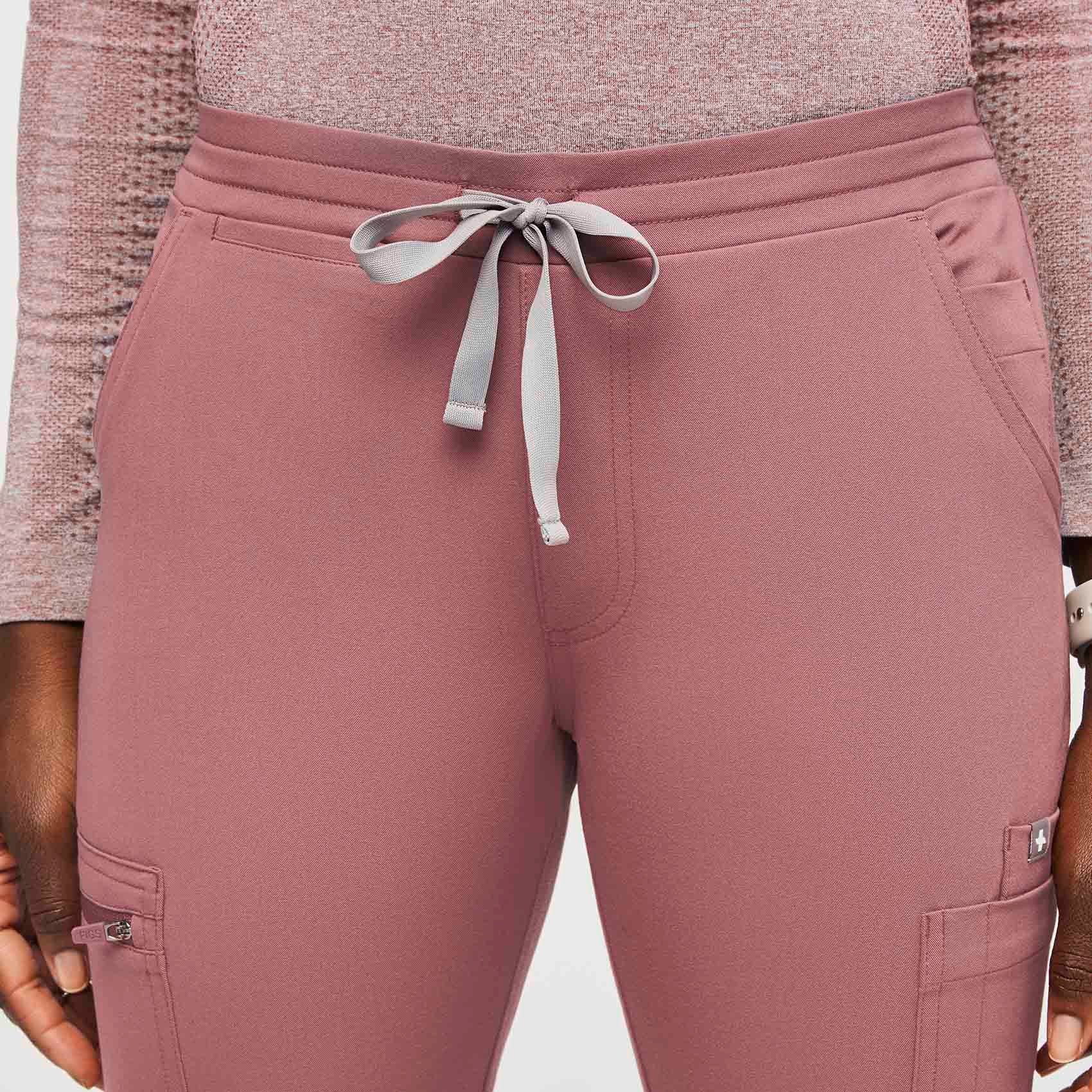 https://cdn.shopify.com/s/files/1/0139/8942/files/Q2_2022_05_MAUVE_YOLA-SKINNY-SCRUB-PANTS_W_AWA_188_b56f4010-4d9b-4780-828f-00f7dbab040c.jpg?v=1689280680