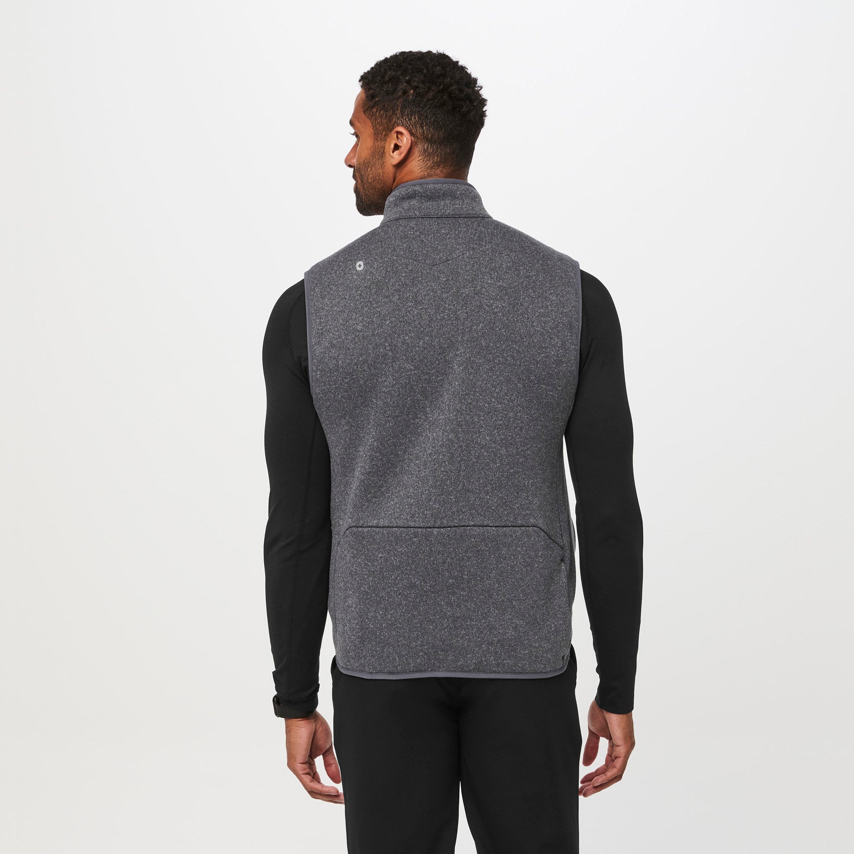 https://cdn.shopify.com/s/files/1/0139/8942/files/Q2_2023_04_HEATHERED-DARK-CHARCOAL_SWEATER-KNIT-VEST_CORE-REFRESH_M_GABE_04594.jpg?v=1690321649