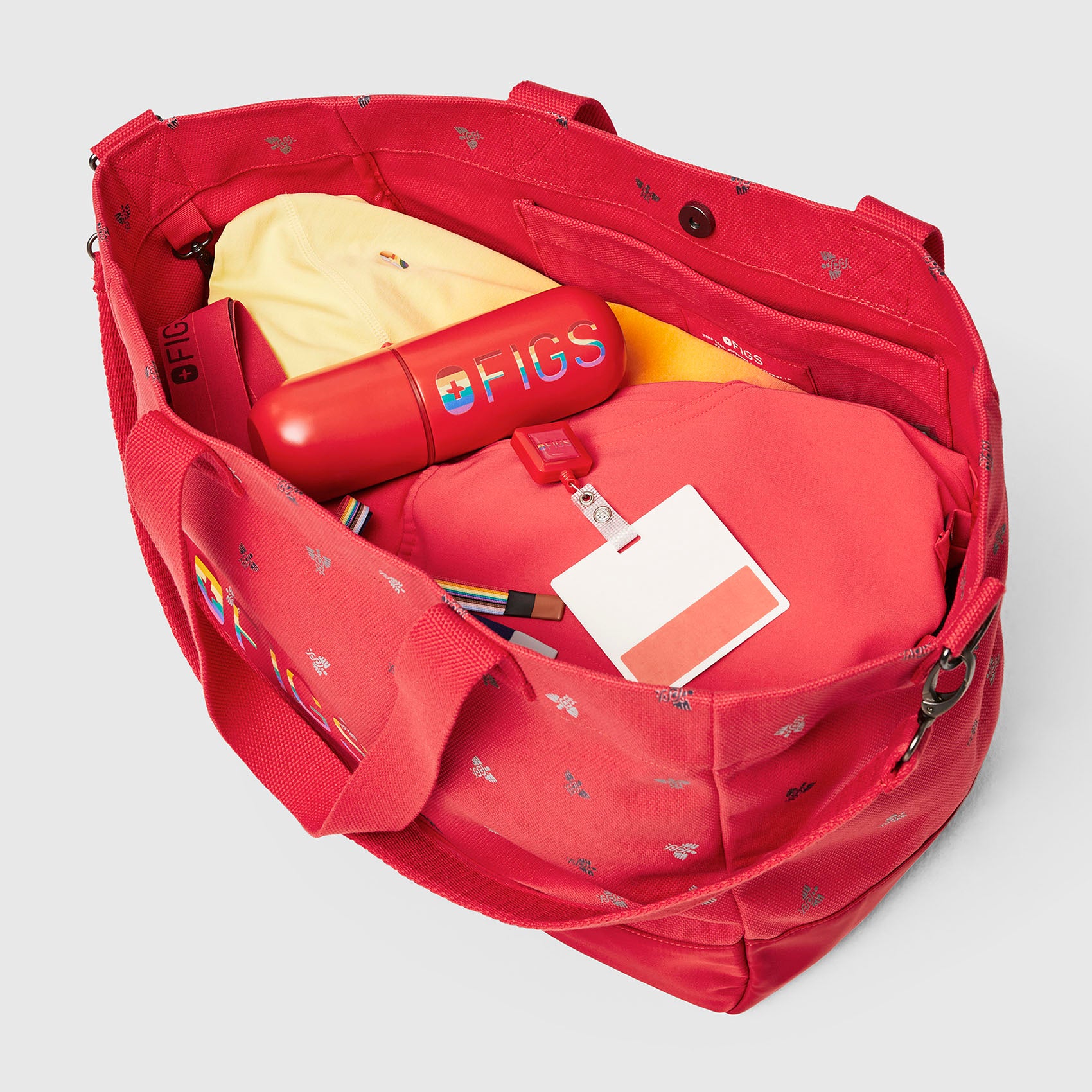 https://cdn.shopify.com/s/files/1/0139/8942/files/Q2_2023_04_HIBISCUS_CADUCUES-LAMINATED-TOTE_U_GHOST_04985.jpg?v=1684874801