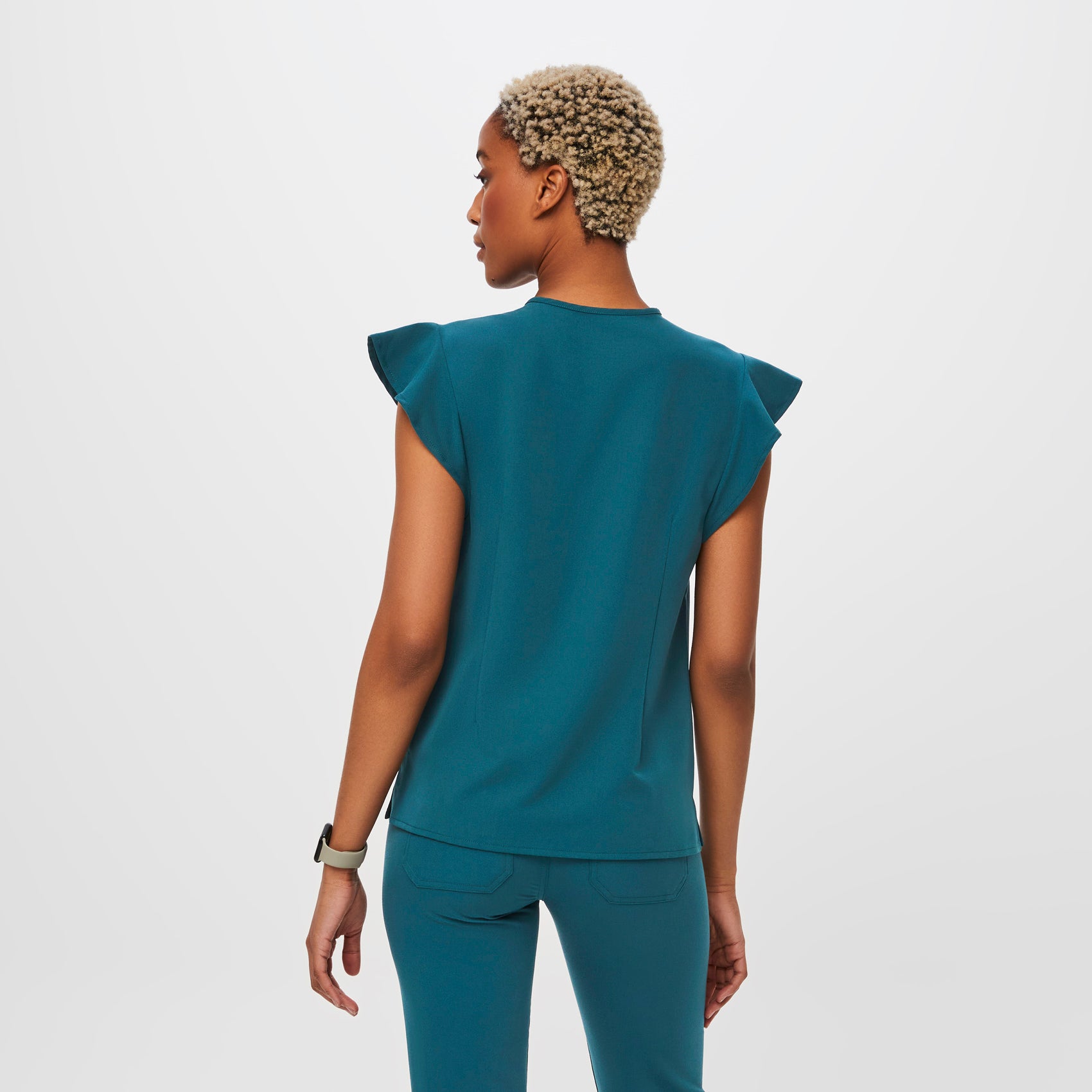 https://cdn.shopify.com/s/files/1/0139/8942/files/Q2_2023_06_CARIBBEAN-BLUE_NATAL-FLUTTER-SLEEVE_W_DEJA_31068.jpg?v=1690225140