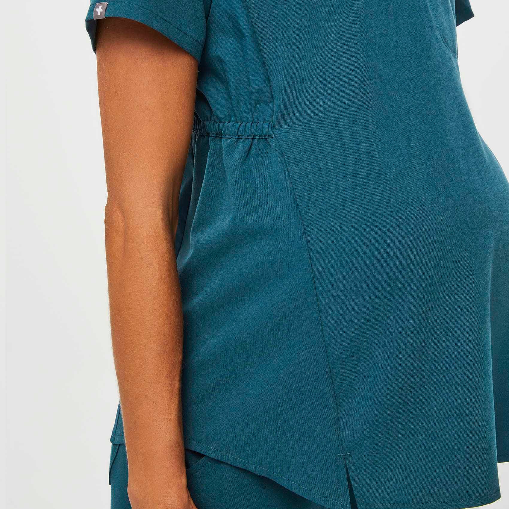 https://cdn.shopify.com/s/files/1/0139/8942/files/Q2_2023_06_CARIBBEAN-BLUE_OCTAVIA-MATERNITY-TOP_W_MADI_35557.jpg?v=1689701348