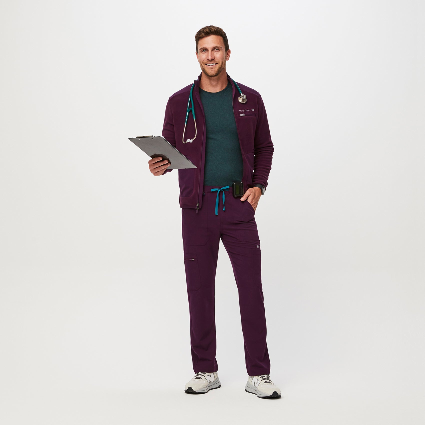 https://cdn.shopify.com/s/files/1/0139/8942/files/Q2_2023_06_DEEP-PURPLE_CAIRO-CARGO-SCRUB-PANTS_M_COREY_34612.jpg?v=1690222200