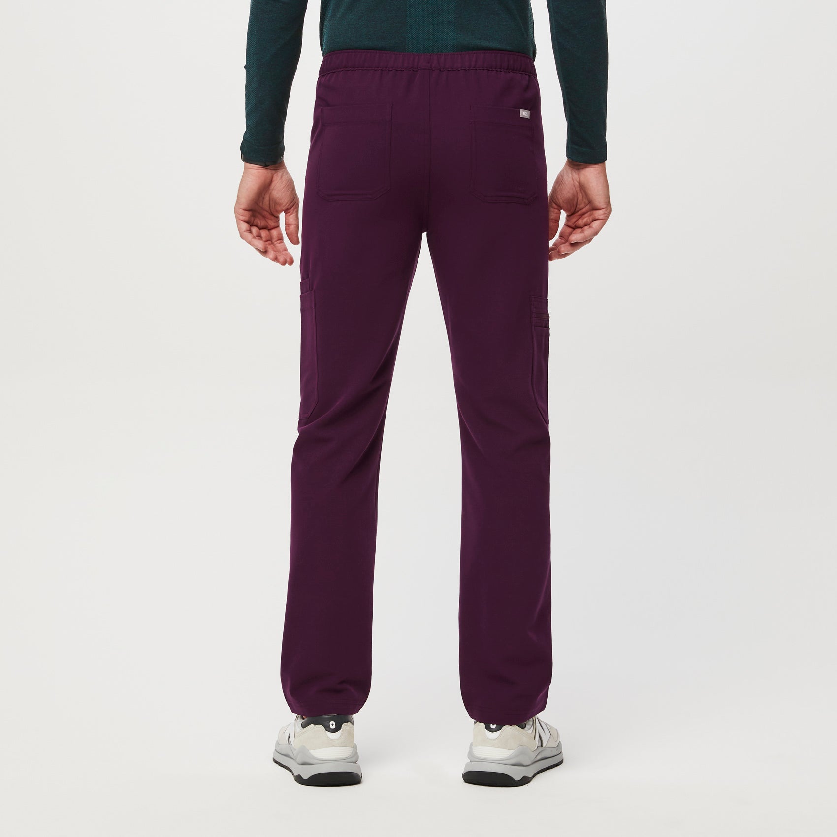 https://cdn.shopify.com/s/files/1/0139/8942/files/Q2_2023_06_DEEP-PURPLE_CAIRO-CARGO-SCRUB-PANTS_M_COREY_34649.jpg?v=1690222200