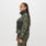 https://cdn.shopify.com/s/files/1/0139/8942/files/Q2_2023_06_MARTINI-OLIVE-CAMO_PRINTED-FREEX-CRAIGHILL-SCRUB-JACKET_W_SALOME_27411.jpg?v=1693355821