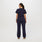 https://cdn.shopify.com/s/files/1/0139/8942/files/Q2_2023_06_NAVY_CATARINA-SCRUB-JUMPSUIT_W_SALOME_28499.jpg?v=1689701275