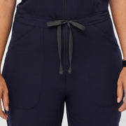 https://cdn.shopify.com/s/files/1/0139/8942/files/Q2_2023_06_NAVY_CATARINA-SCRUB-JUMPSUIT_W_SALOME_28506.jpg?v=1689701275