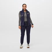 https://cdn.shopify.com/s/files/1/0139/8942/files/Q2_2023_06_NAVY_OS-FLEECE-VEST_W_SALOME_29250.jpg?v=1692134469