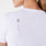 Camiseta de manga corta para debajo del uniforme médico El cuidado de la salud es humano Optic White
