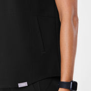 https://cdn.shopify.com/s/files/1/0139/8942/files/Q2_2024_4_BLACK_MANILASCRUBTOP_MADI_380.jpg?v=1715905381