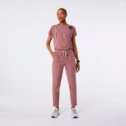 https://cdn.shopify.com/s/files/1/0139/8942/files/Q2_2024_4_MAUVE_LILLIEHIGHWAISTEDSCRUBPANT_DEJA42_da68a6d7-0621-4247-bdb2-ed35256659a0.jpg?v=1714153320