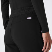 https://cdn.shopify.com/s/files/1/0139/8942/files/Q2_2024_5_BLACK_HWCORDOVAFLARESCRUBPANT_CHARO_1249_d6f2a7bc-71ef-407d-920a-edb9e6addd78.jpg?v=1718127993