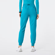 https://cdn.shopify.com/s/files/1/0139/8942/files/Q2_2024_5_TEAL_HWUMANJOGGER_NATALIE_682.jpg?v=1736359415