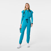 https://cdn.shopify.com/s/files/1/0139/8942/files/Q2_2024_5_TEAL_RAFAELAJUMPSUIT_NATALIE_388.jpg?v=1740448898