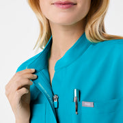 https://cdn.shopify.com/s/files/1/0139/8942/files/Q2_2024_5_TEAL_RAFAELAJUMPSUIT_NATALIE_452.jpg?v=1736351607