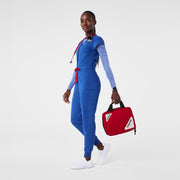 https://cdn.shopify.com/s/files/1/0139/8942/files/Q2_2024_5_WINNINGBLU_V-NECKJOGGERSCRUBJUMPSUIT_AWA_1641.jpg?v=1720570810