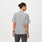 https://cdn.shopify.com/s/files/1/0139/8942/files/Q3_2023_07_HEATHERED-GREY_PRO-PIQUE-MOCK-NECK-SCRUBPOLO_W_LOGAN_10489.jpg?v=1692207709
