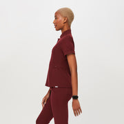 https://cdn.shopify.com/s/files/1/0139/8942/files/Q3_2023_09_BURGUNDY_INALA-SLIM_CORE-REFRESH_W_DEJA_29091.jpg?v=1705433652