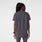 https://cdn.shopify.com/s/files/1/0139/8942/files/Q3_2024_8_CHARCOAL_HALLEV-NECKTUNICSCRUBTOP_AWA_211.jpg?v=1727733083