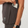 https://cdn.shopify.com/s/files/1/0139/8942/files/Q4_2023_10_DARK-BROWN_BO-KATAN-PLEATED-SCRUB-TOP_W_MADI_03030.jpg?v=1698686996
