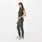 https://cdn.shopify.com/s/files/1/0139/8942/files/Q4_2023_11_MOSS_RAFAELAJUMPSUIT_FULLBODY4_W_MELANIE_895_new.jpg?v=1740448864