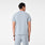 https://cdn.shopify.com/s/files/1/0139/8942/files/Q4_2024_11_DUSTYBLUE_CORFIELDHENLEYSCRUBTOP_SCOTT_143.jpg?v=1732565373