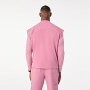 https://cdn.shopify.com/s/files/1/0139/8942/files/Q4_2024_12_CHALKPINK_ANDESRELAXEDSCRUBTOP_TERRANCE_0702.jpg?v=1736438650