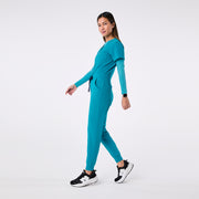 https://cdn.shopify.com/s/files/1/0139/8942/files/Q4_2024_12_TEAL_CATARINAV-NECKJUMPSUIT_CHARO_1439.jpg?v=1736357329