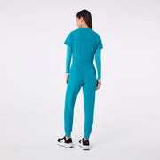 https://cdn.shopify.com/s/files/1/0139/8942/files/Q4_2024_12_TEAL_CATARINAV-NECKJUMPSUIT_CHARO_1445.jpg?v=1736357329
