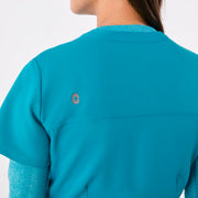https://cdn.shopify.com/s/files/1/0139/8942/files/Q4_2024_12_TEAL_CATARINAV-NECKJUMPSUIT_CHARO_1449.jpg?v=1736357329