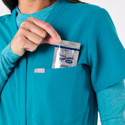 https://cdn.shopify.com/s/files/1/0139/8942/files/Q4_2024_12_TEAL_CATARINAV-NECKJUMPSUIT_CHARO_1453.jpg?v=1736357329