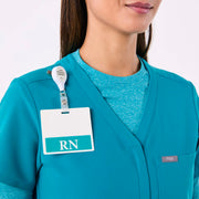 https://cdn.shopify.com/s/files/1/0139/8942/files/Q4_2024_12_TEAL_CATARINAV-NECKJUMPSUIT_CHARO_1458.jpg?v=1736357329
