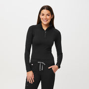 https://cdn.shopify.com/s/files/1/0139/8942/products/Q1_2023_02_BLACK_SALTA-PERFORMANCE-ZIP_W_JOSIE_43551.jpg?v=1681414995