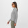 https://cdn.shopify.com/s/files/1/0139/8942/products/Q1_2023_02_HEATHER-GREY_SLIM-TECHNICAL-LS-POLO_W_NATALIE_32216.jpg?v=1680563372